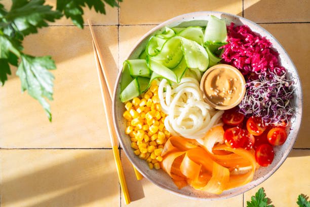 Healthy Rainbow Bowl with Peanut Sauce (Hard Light Photography)